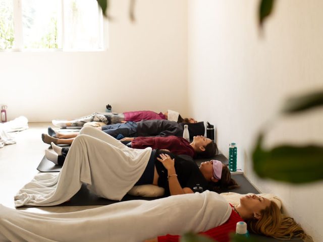 a group of people laying on the floor in a room